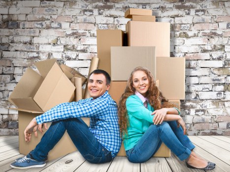 Professional movers handling office equipment in Queens Park